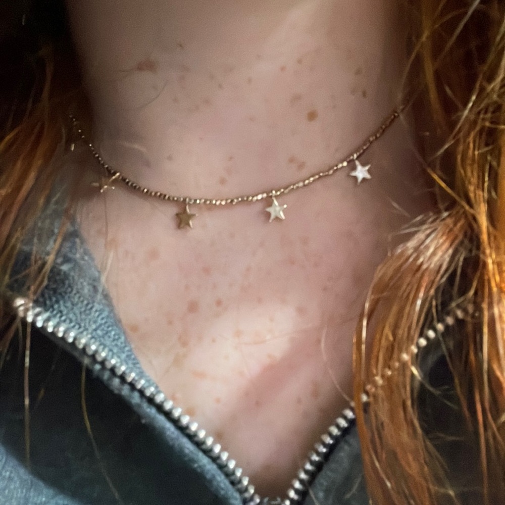 gold star necklace with unknown brand